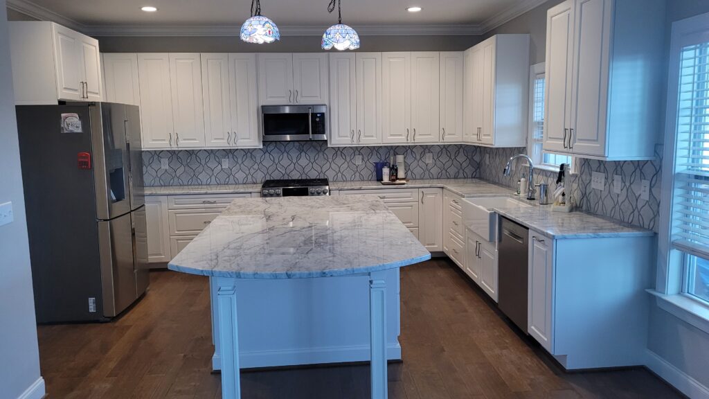 Finished kitchen with island seating and pendant lighting